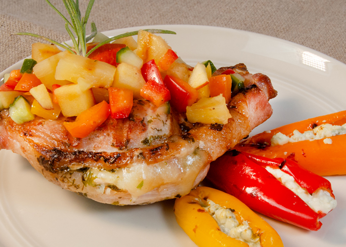 Herb-Filled Pork Chops with Stuffed Peppers and Pineapple Salsa